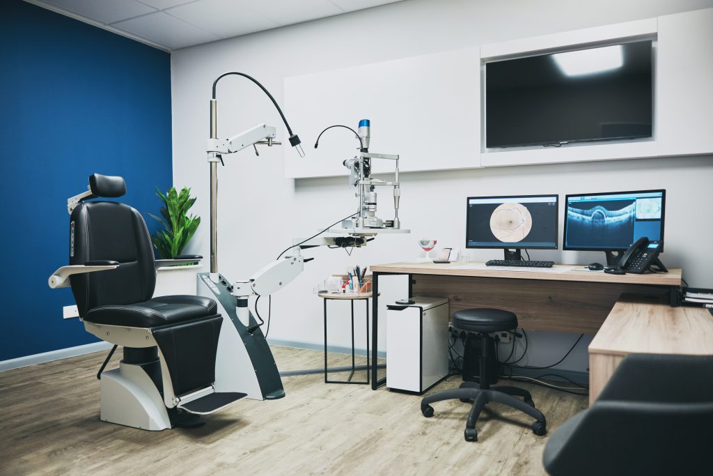 Optometry, empty room and equipment for vision test for eye care in a optical clinic or store. Opti.